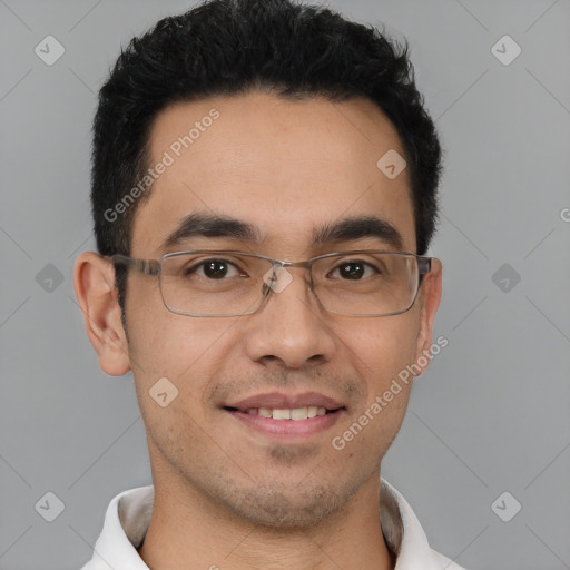 Joyful white young-adult male with short  black hair and brown eyes