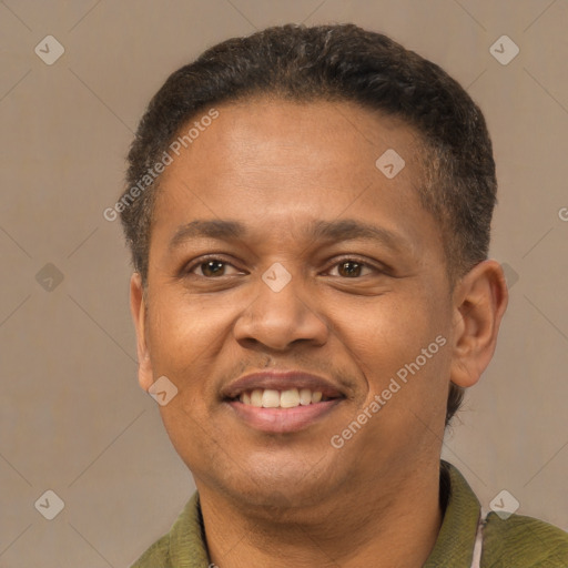 Joyful latino adult male with short  brown hair and brown eyes