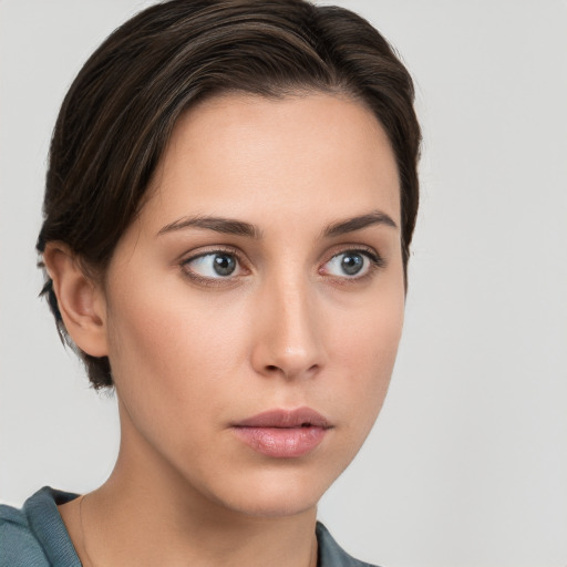 Neutral white young-adult female with short  brown hair and grey eyes