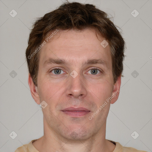 Joyful white adult male with short  brown hair and grey eyes