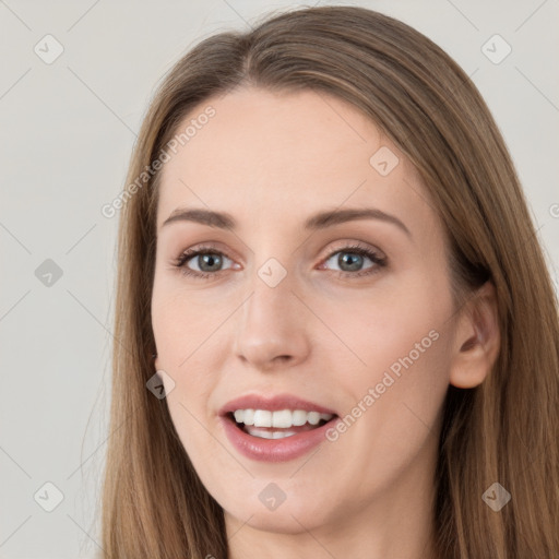 Joyful white young-adult female with long  brown hair and grey eyes