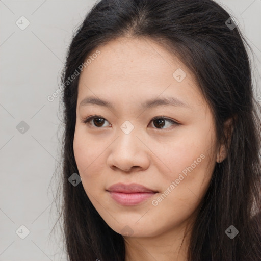 Joyful asian young-adult female with long  brown hair and brown eyes