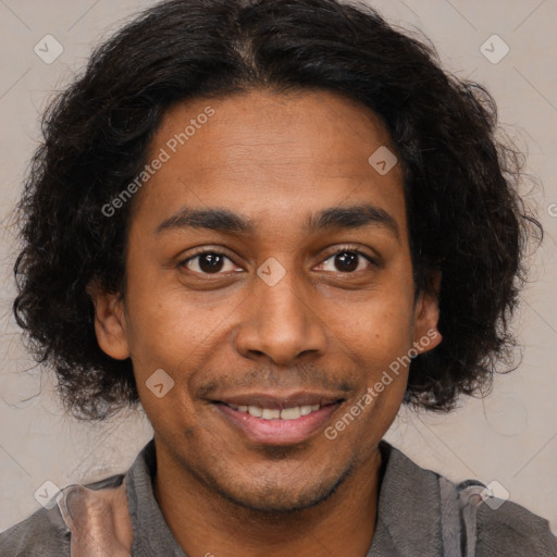 Joyful black young-adult male with short  brown hair and brown eyes