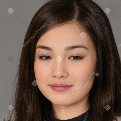 Joyful asian young-adult female with long  brown hair and brown eyes