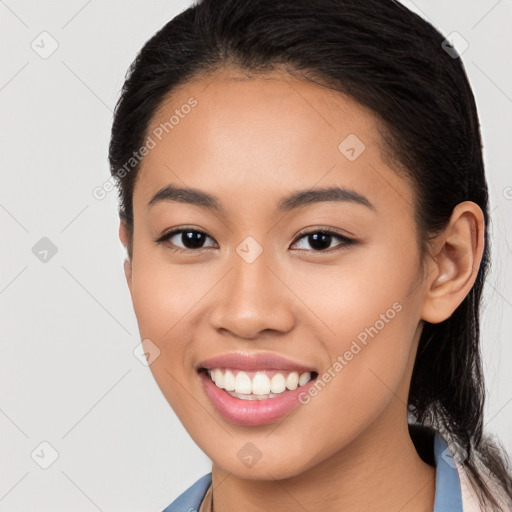 Joyful white young-adult female with long  black hair and brown eyes