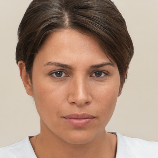 Neutral white young-adult female with short  brown hair and brown eyes