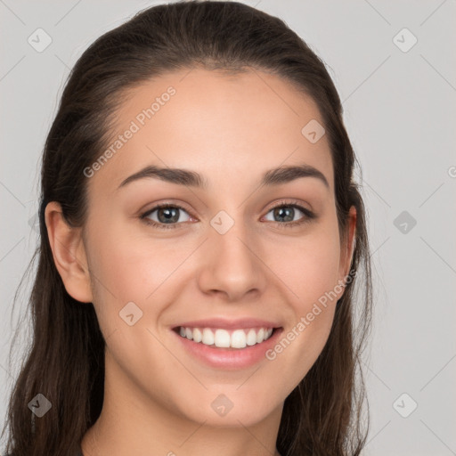 Joyful white young-adult female with long  brown hair and grey eyes