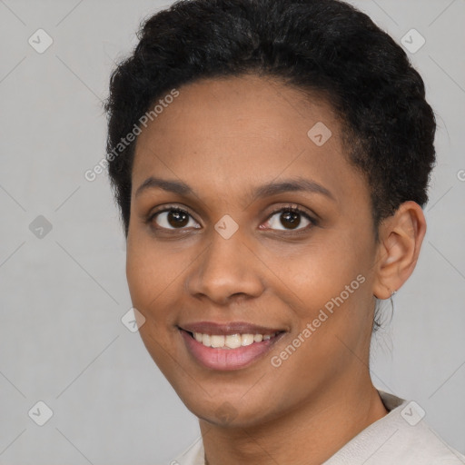 Joyful black young-adult female with short  brown hair and brown eyes