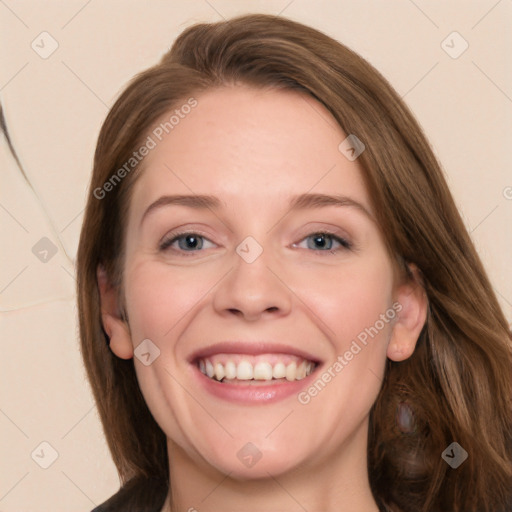 Joyful white young-adult female with long  brown hair and blue eyes