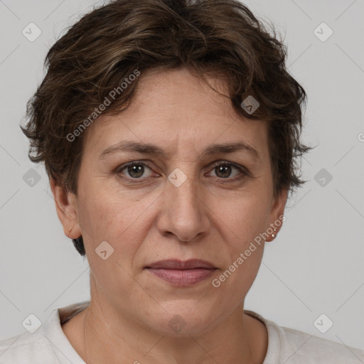 Joyful white adult female with short  brown hair and brown eyes