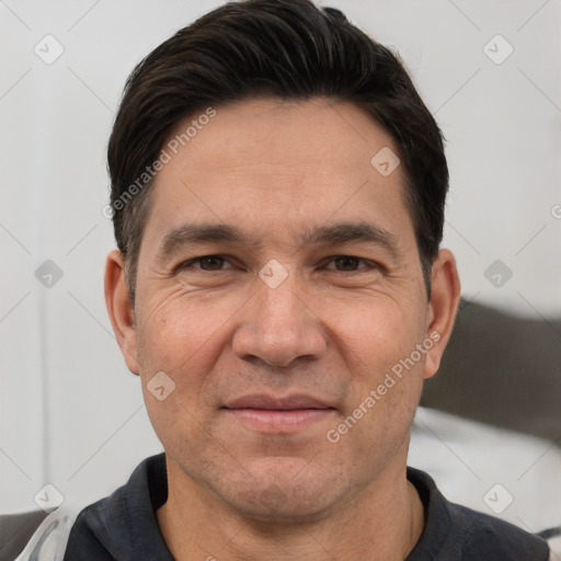 Joyful white adult male with short  brown hair and brown eyes