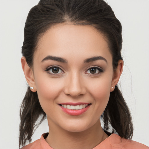 Joyful white young-adult female with medium  brown hair and brown eyes