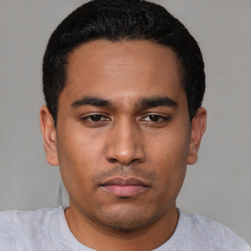 Neutral latino young-adult male with short  black hair and brown eyes