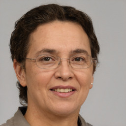 Joyful white middle-aged female with short  brown hair and grey eyes