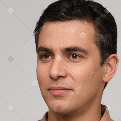 Joyful white adult male with short  brown hair and brown eyes