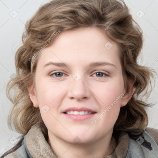 Joyful white young-adult female with medium  brown hair and blue eyes