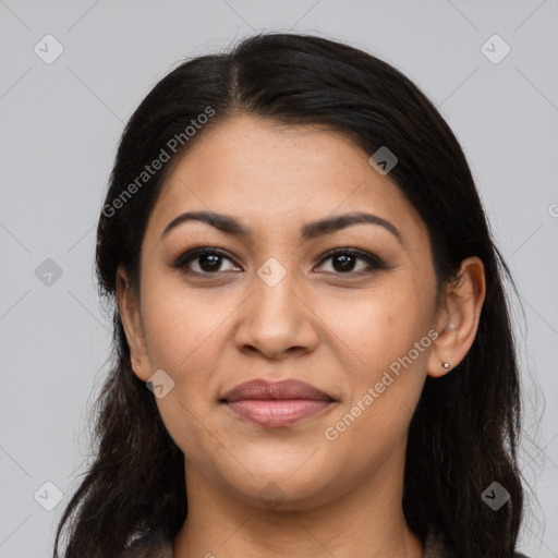 Joyful latino young-adult female with long  brown hair and brown eyes