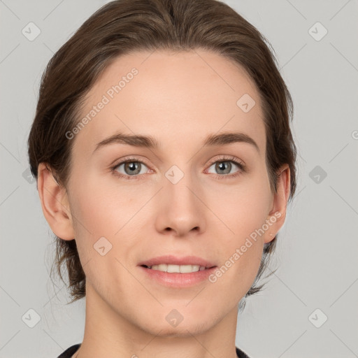 Joyful white young-adult female with medium  brown hair and grey eyes