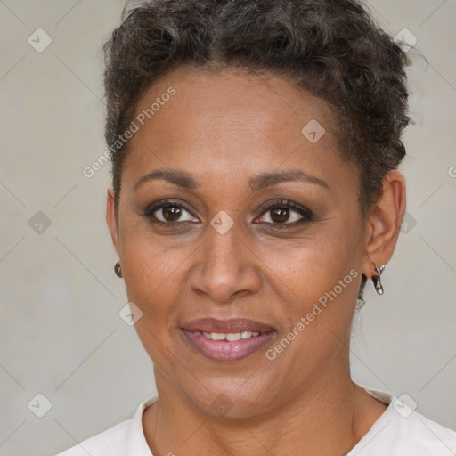 Joyful black adult female with short  brown hair and brown eyes