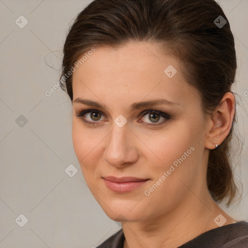 Joyful white young-adult female with medium  brown hair and grey eyes