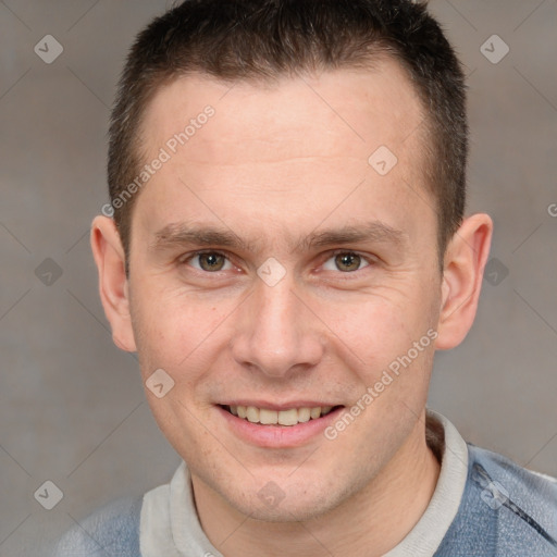 Joyful white adult male with short  brown hair and grey eyes