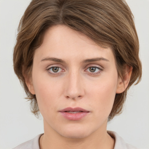 Neutral white young-adult female with medium  brown hair and grey eyes