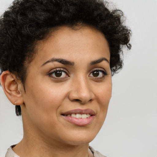 Joyful latino young-adult female with short  brown hair and brown eyes