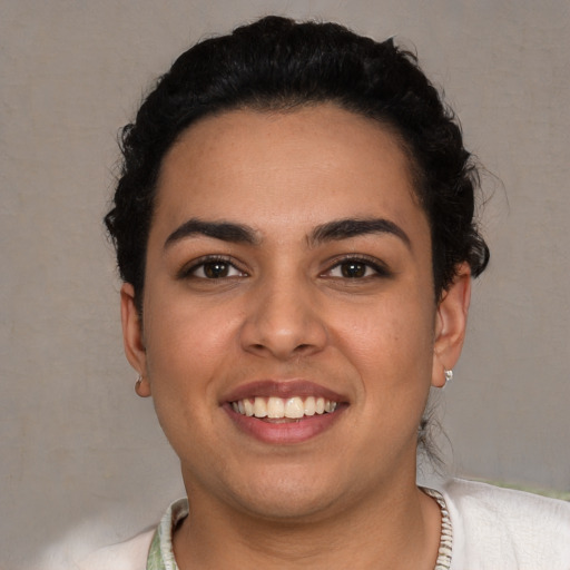 Joyful white young-adult female with short  brown hair and brown eyes