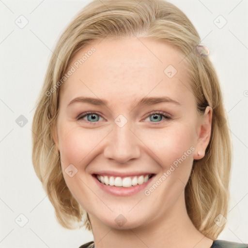 Joyful white young-adult female with medium  brown hair and blue eyes