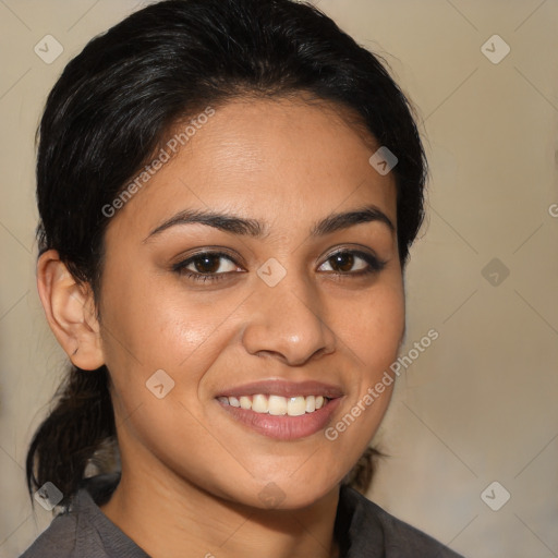 Joyful latino young-adult female with medium  brown hair and brown eyes