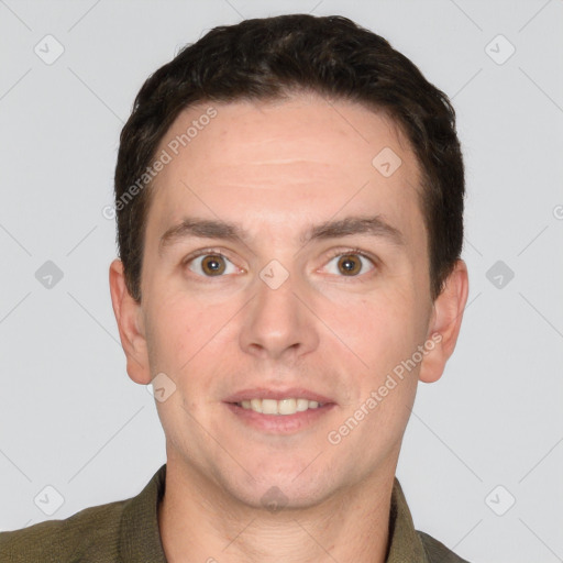 Joyful white adult male with short  brown hair and grey eyes