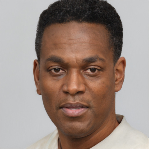 Neutral black adult male with short  black hair and brown eyes