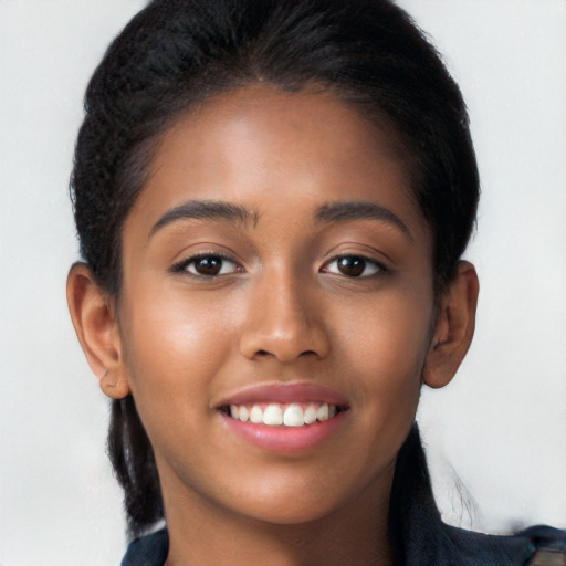 Joyful latino young-adult female with long  brown hair and brown eyes