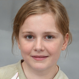 Joyful white child female with medium  brown hair and grey eyes