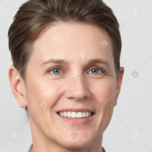 Joyful white adult female with short  brown hair and grey eyes