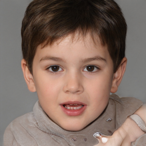 Joyful white child male with short  brown hair and brown eyes