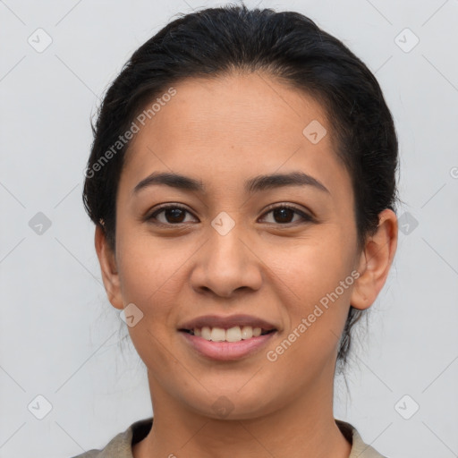 Joyful latino young-adult female with short  brown hair and brown eyes