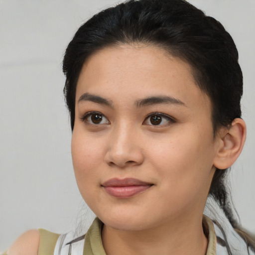 Joyful latino young-adult female with medium  black hair and brown eyes