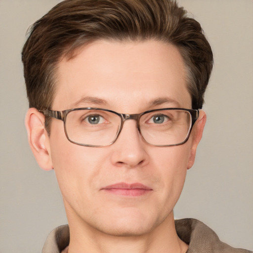 Joyful white adult male with short  brown hair and grey eyes