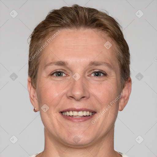 Joyful white adult male with short  brown hair and grey eyes