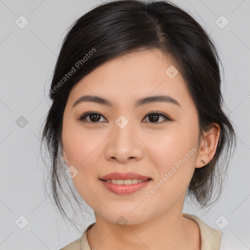 Joyful asian young-adult female with medium  brown hair and brown eyes