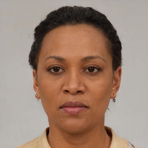 Neutral latino adult female with short  brown hair and brown eyes