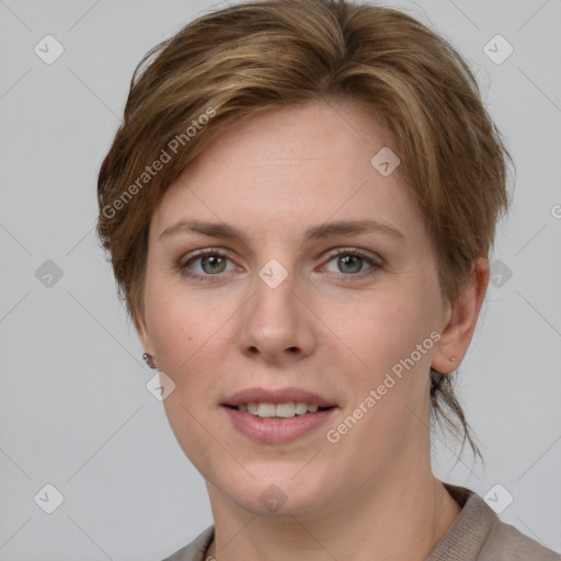 Joyful white young-adult female with short  brown hair and grey eyes