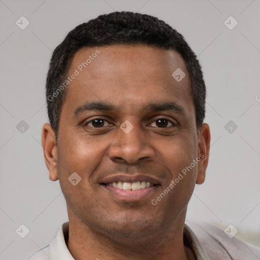 Joyful latino young-adult male with short  brown hair and brown eyes