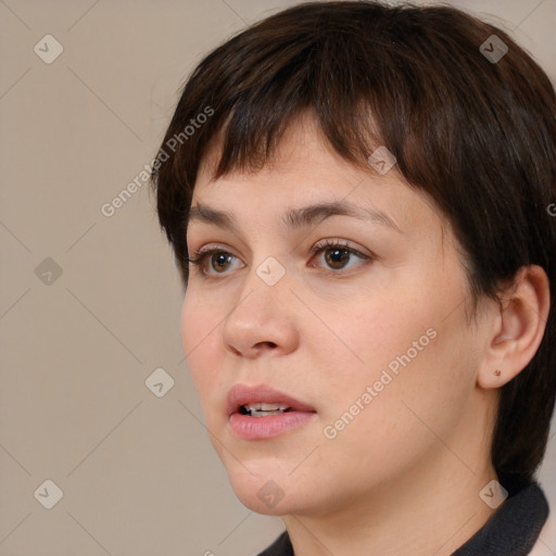 Neutral white young-adult female with short  brown hair and brown eyes