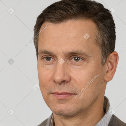 Joyful white adult male with short  brown hair and brown eyes