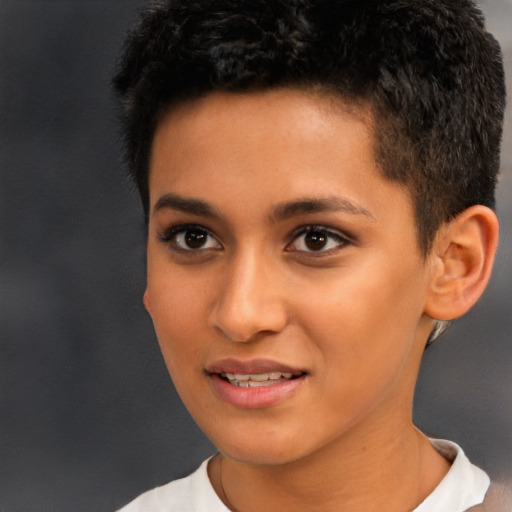 Joyful latino young-adult male with short  brown hair and brown eyes