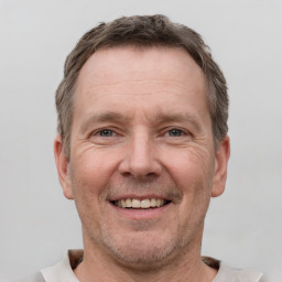 Joyful white adult male with short  brown hair and grey eyes