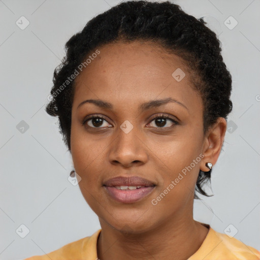 Joyful black adult female with short  black hair and brown eyes