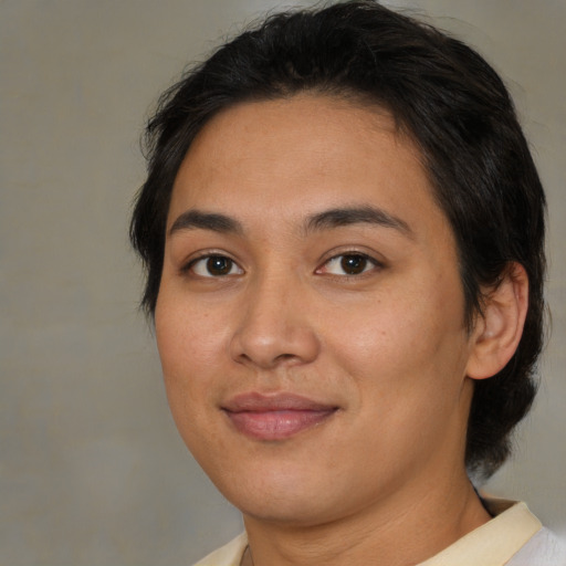 Joyful asian young-adult female with medium  brown hair and brown eyes